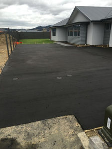 Coloured concrete driveway with broom finish - Mosgiel, Dunedin